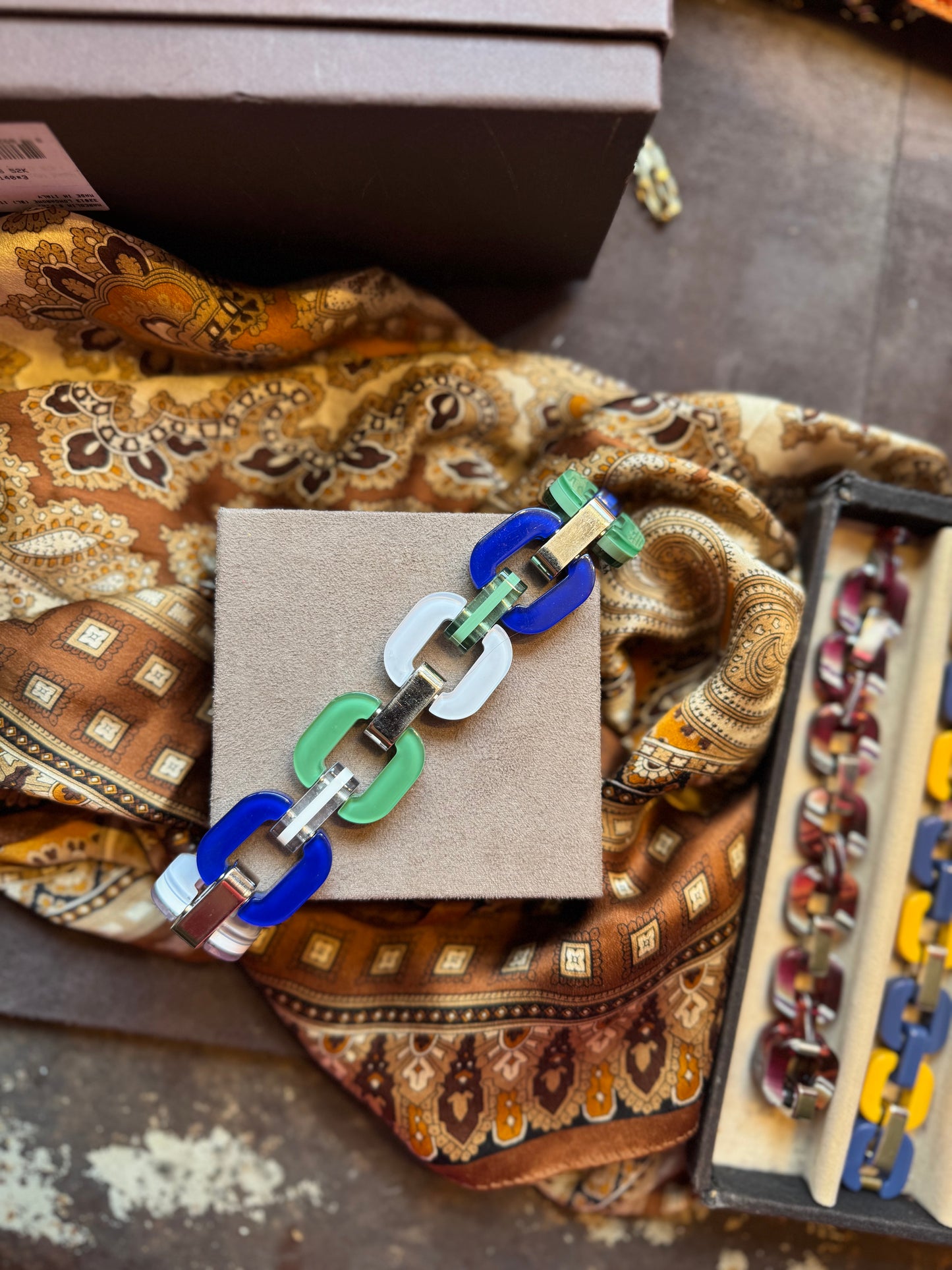 Blue, green and white chain bracelet.