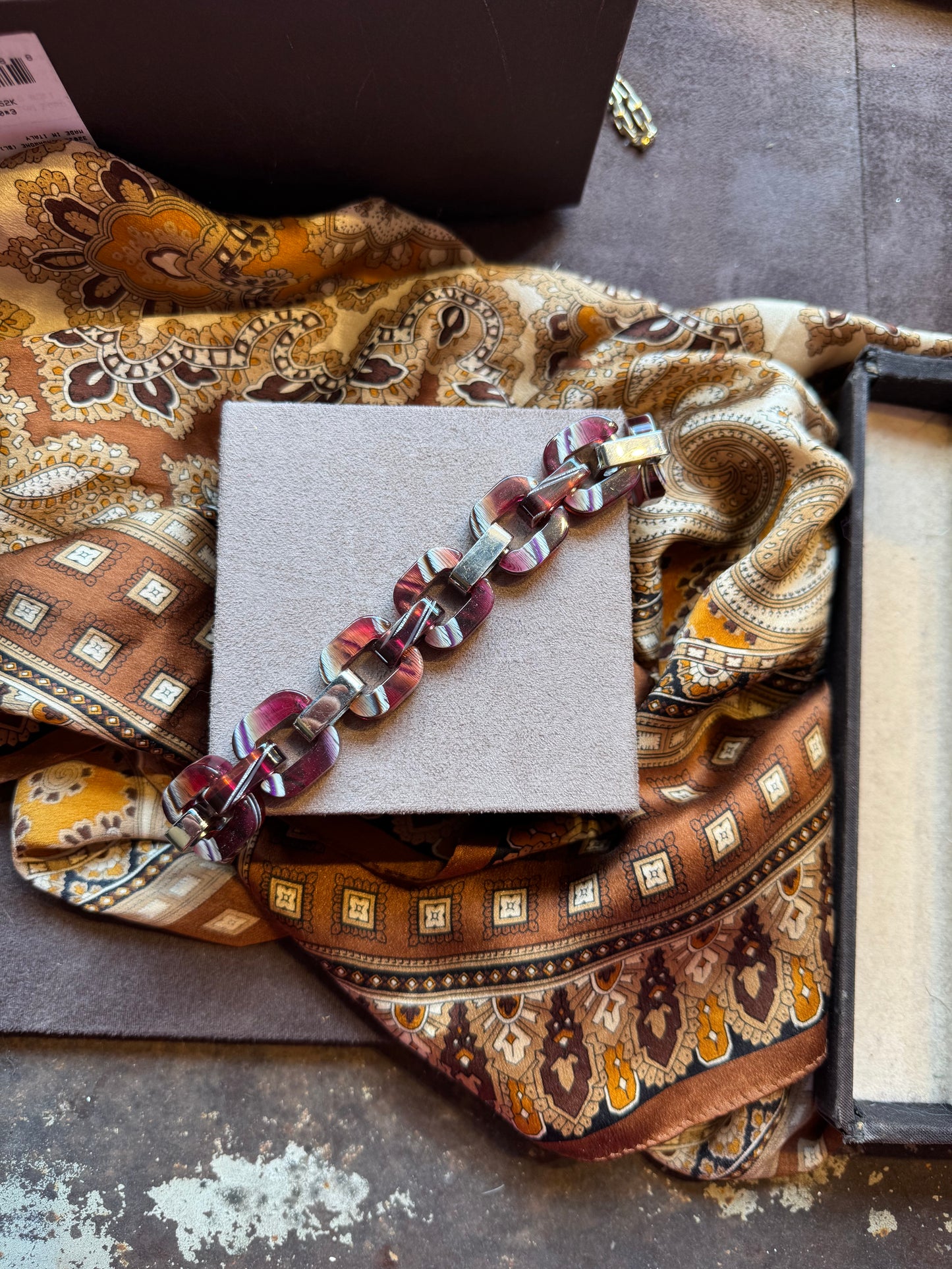 Multi-tone burgundy patterned bracelet.