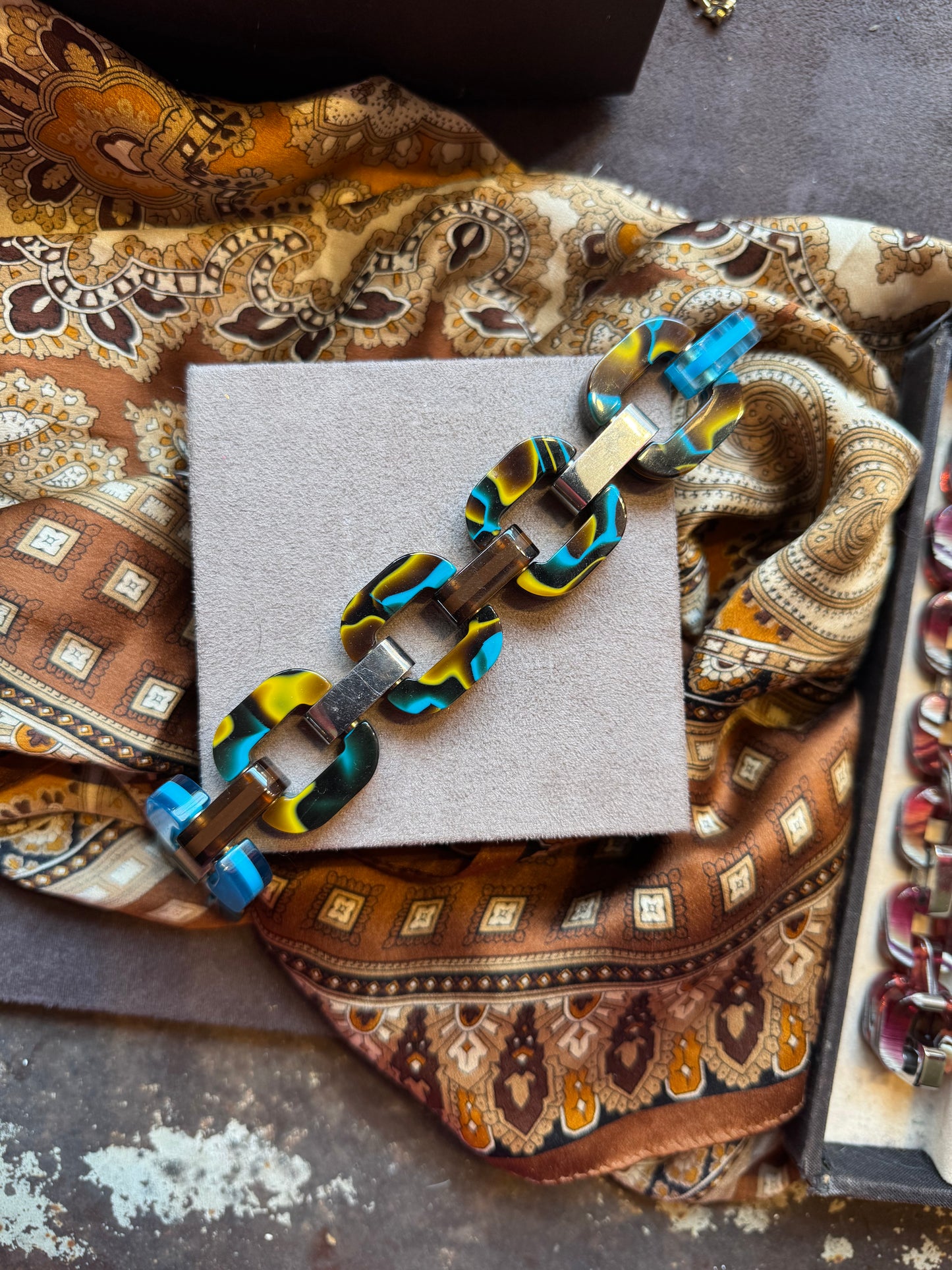 Bracelet with blue and yellow accents.