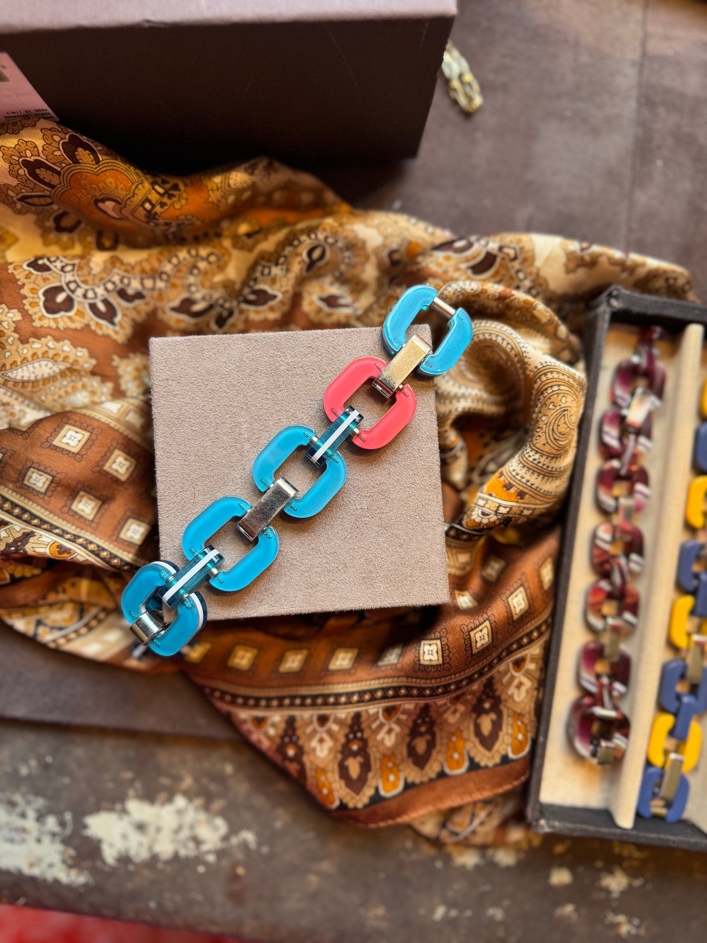 Blue bracelet with pink link.