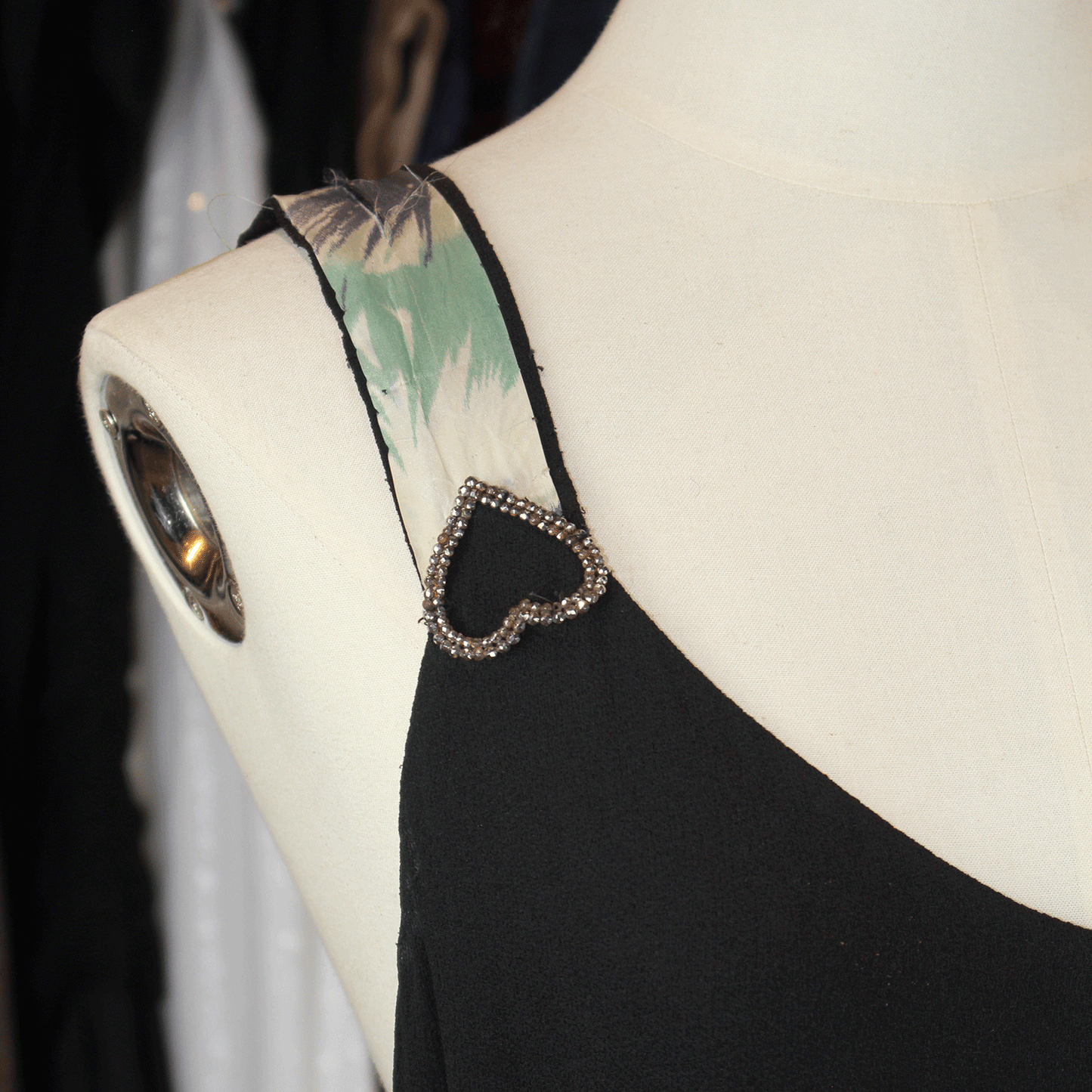 Inverted crystal diamante hearts on black vintage evening dress.